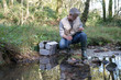© goodluz - Biologist testing water quality of river
