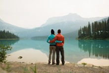 Hiker Couple Hugging Near The Lake