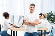 © LIGHTFIELD STUDIOS - young happy caucasian student boy in classroom with friends