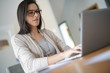 © goodluz - Woman working from home on laptop computer