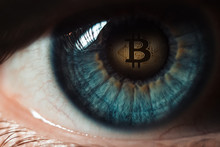 Bitcoin. Eye Of A Person With The Bitcoin Coin Logo In The Pupil
