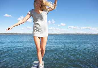 Young woman on diving platform