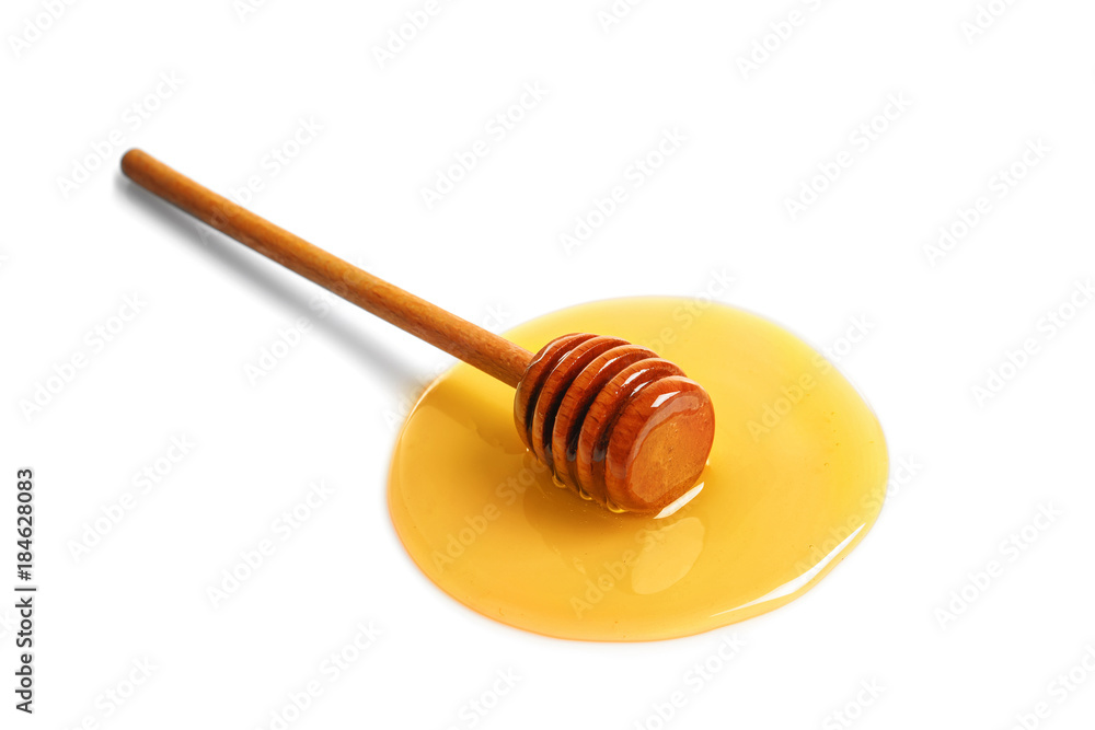 Sweet honey and dipper on white background
