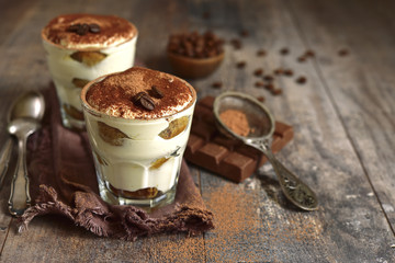 Homemade traditional italian dessert tiramisu with mascarpone cheese,savoyardi biscuit,coffee and whipped cream.