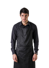 Sticker - Young chef or waiter posing, wearing black apron and shirt isolated on white background