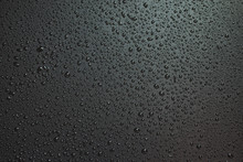 Small Liquid Drops On A Black Background.