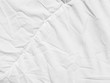 © srckomkrit - crumpled white fabric cloth texture