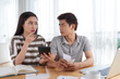 © DragonImages - Unhappy Young Family Calculating Expenses