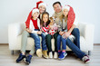 © Nichizhenova Elena - Family celebrating christmas