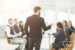 © yurolaitsalbert - senior Manager of the company holds a working meeting with business team in modern office