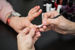 © Artem Zakharov - Closeup shot man making manicure to woman in beauty salon