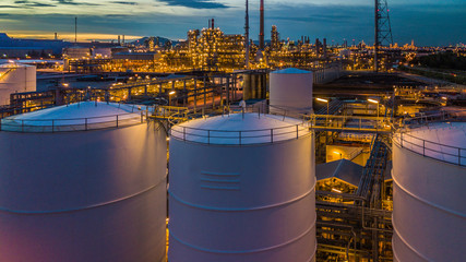 Aerial view oil terminal is industrial facility for storage of oil and petrochemical products ready for transport to further storage facilities.