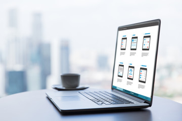 laptop with smartphone interface design on screen