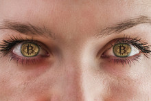 Bitcoin. Eyes Of A Person With The Logo Bitcoin.