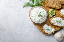 Homemade Greek Tzatziki Sauce In A Glass Bowl With Ingredients A