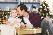© snedorez - New Year's image of son and father with gift