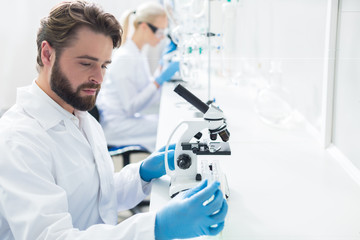 professional male biologist focusing on his work