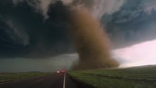 Dusty Tornado With Storm Chasers
