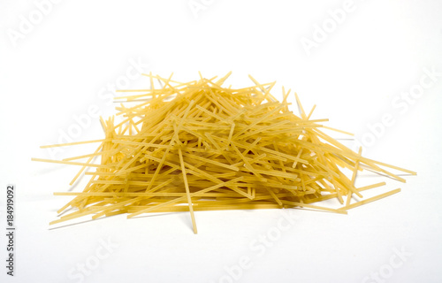 Fotomural yellow pasta spaghetti on white background