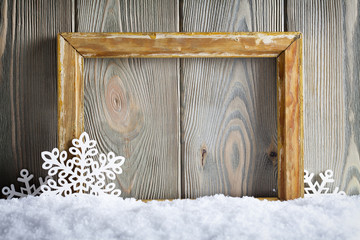 Sticker - Christmas background - picture frame and snowflakes on snow and wooden wall