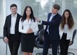 © ASDF - boss and business team in office