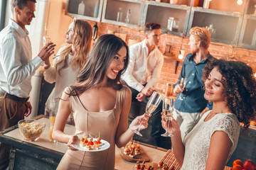 Wall Mural - Group of friends party together indoors celebration