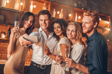 Wall Mural - Group of friends party together indoors celebration