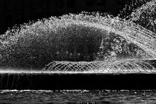 Jets Of Fountain Water Frozen In The Air. Abstract Black And White Image.