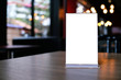© Charlie's - Mock up Menu frame standing on wood table in Bar restaurant cafe. space for text