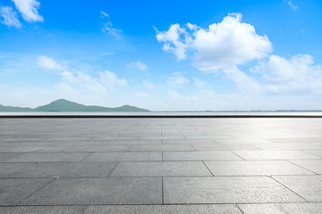 Outdoor viewing platform and lake landscape under the blue sky