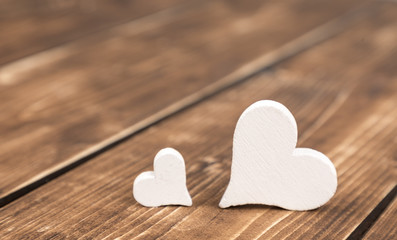 two hearts on a wooden background