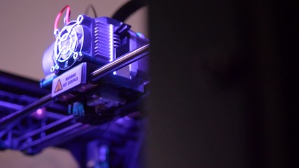 Wall Mural - Close-up of 3D printer working. Head of 3d printer in action. 3D printer is a new generation of technology is not standing still, future today