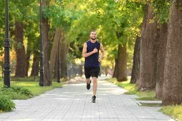 Sticker - Sporty young man running outdoors