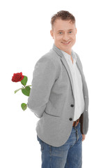 Wall Mural - Handsome mature man with red rose, isolated on white