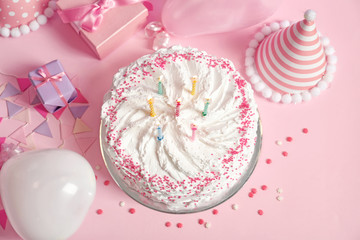 Wall Mural - Birthday cake with candles on pink table