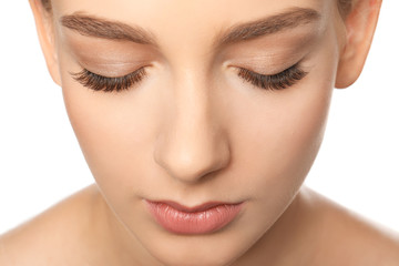 Wall Mural - Beautiful woman with long eyelashes on white background, closeup