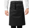 © Africa Studio - Waiter in black apron on white background