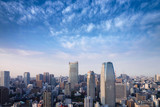 Fototapeta  - Landscape of tokyo city skyline in Aerial view with skyscraper, modern office building and blue sky with cloudy sky background in Tokyo metropolis, Japan.