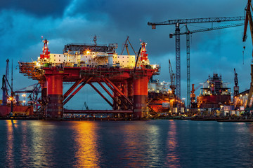 Wall Mural - Oil Rig in the shipyard for maintenance at night.