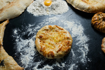 Wall Mural - imeretian khachapuri is national Georgian cuisine dish. Baked bread with cheese filling. Delicious pastry snack