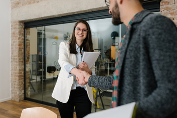 Wall Mural - Firm handshake and approval smile