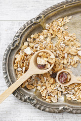 Canvas Print - Two wooden spoons with muesli.