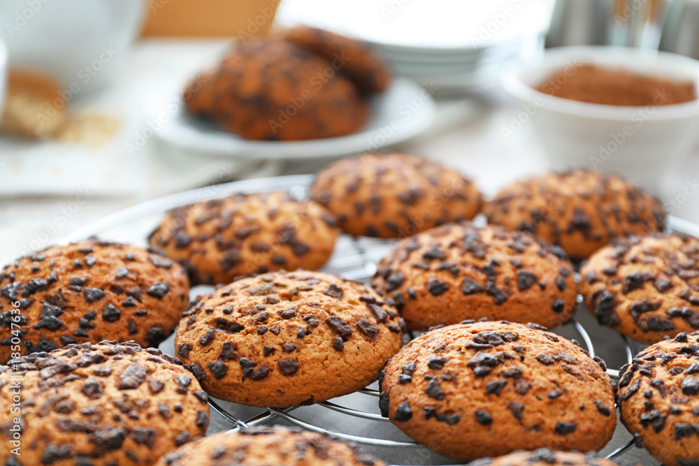 Cooling rack with chocolate chip oatmeal cookies on table