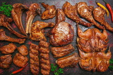 Poster - Different grilled meat on slate plate, top view