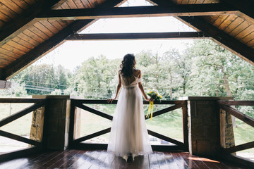 Bride holding yellow bouquet on the wedding.