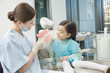 © View Stock - Cute little girl and dentist