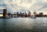 Fototapeta  - View of Manhattan bridge and Manhattan in New York, USA at sunset