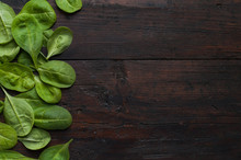 Fresh Green Spinach On Vintage Wooden Texture