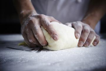 Wall Mural - Kneading bread dough