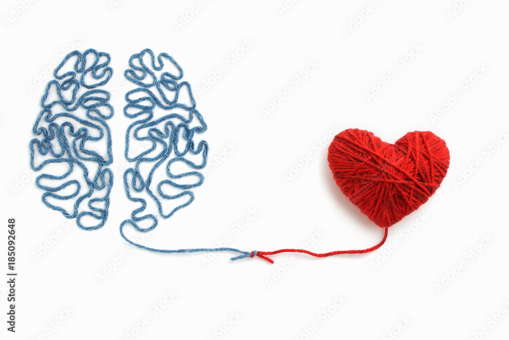 Heart and brain connected by a knot on a white background - obrazy, fototapety, plakaty 